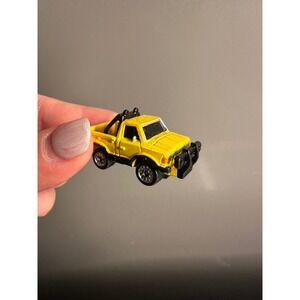 VINTAGE 1986 GALOOB MICRO MACHINES DATSUN 4X4 PICKUP TRUCK YELLOW W/ ROLL CAGE